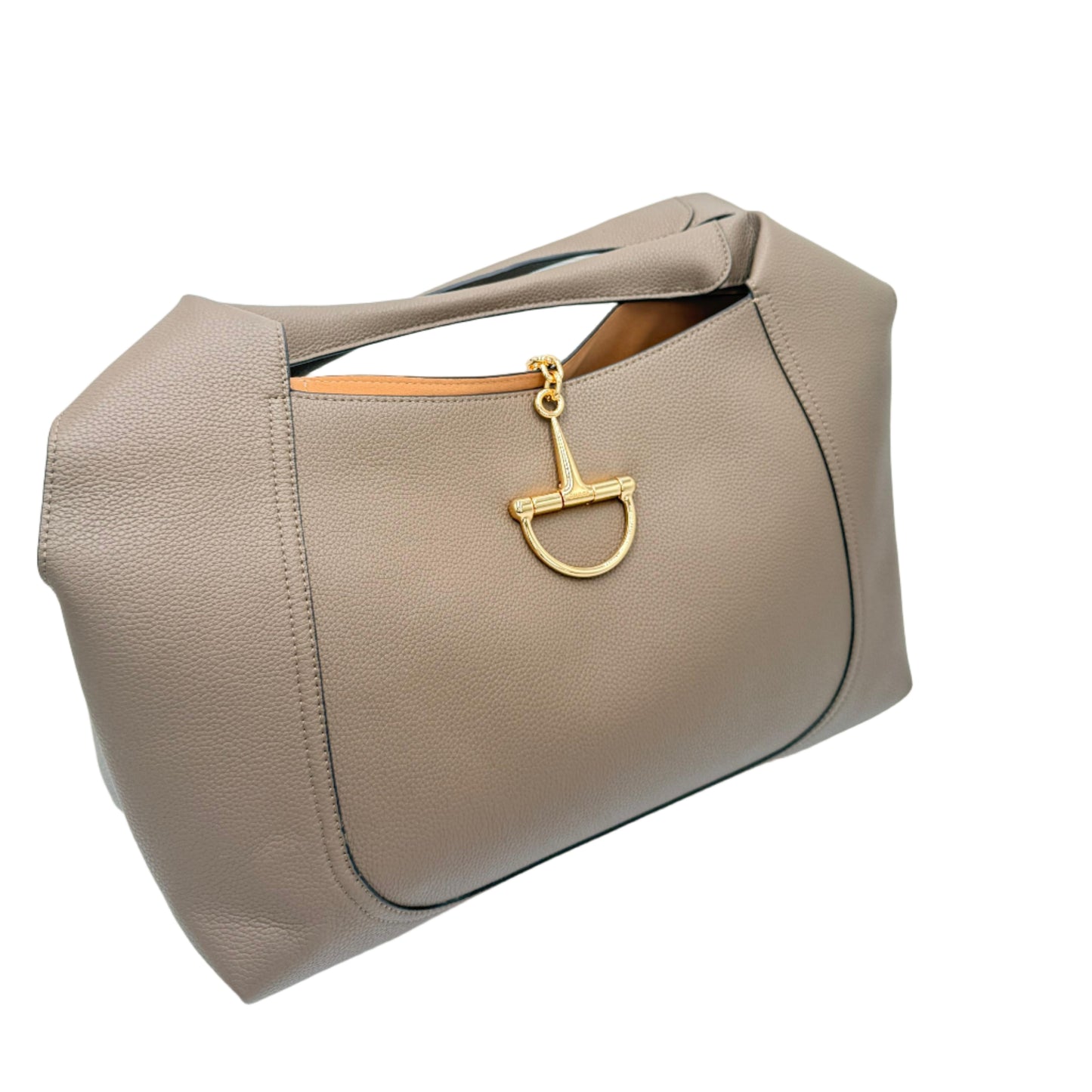 Beige handbag with a gold clasp on a light blue background
