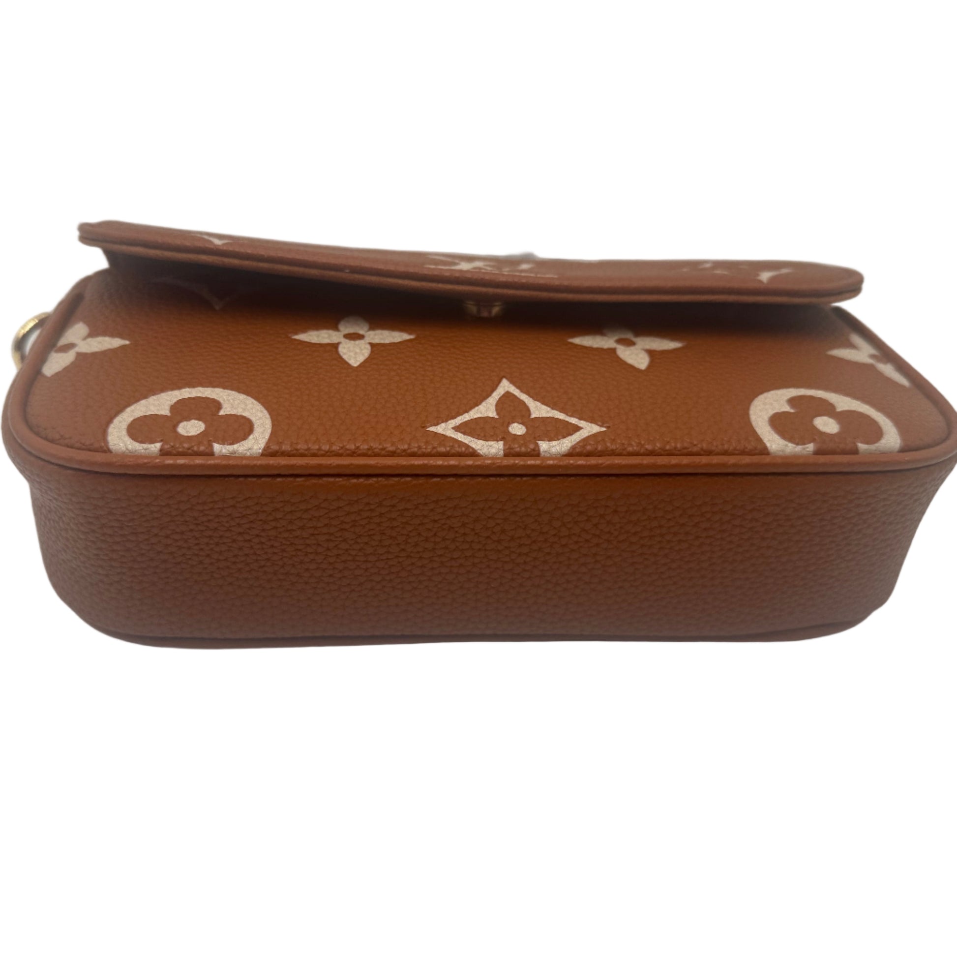 Brown handbag with white logo pattern on a white background