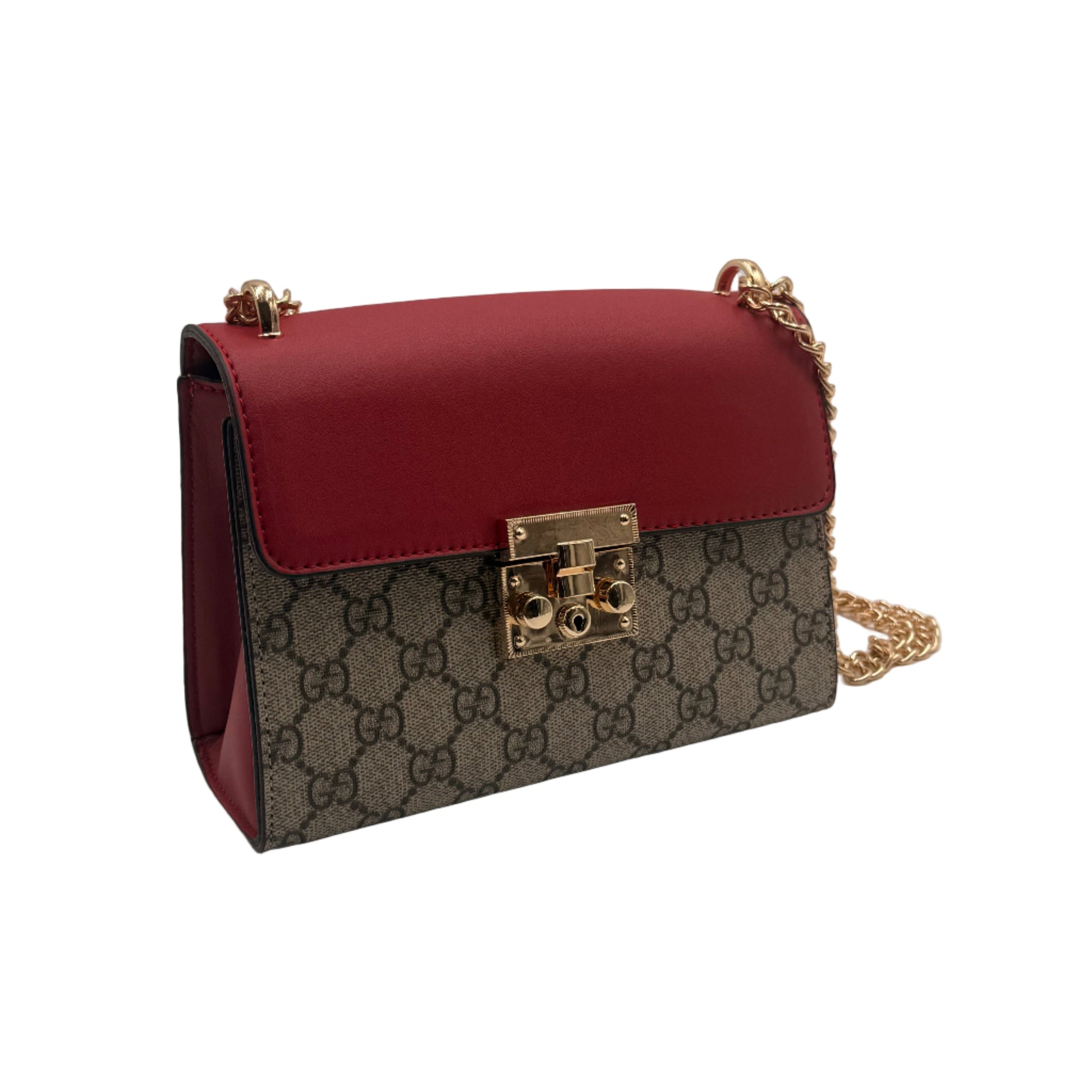 Designer handbag with red leather and patterned body on a light gray background