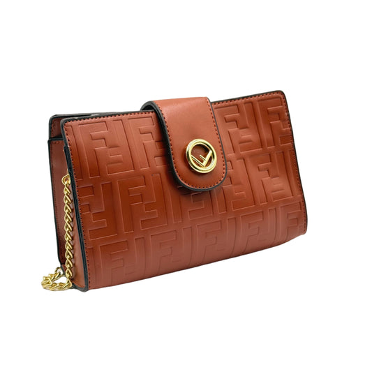 Brown textured wallet with gold chain on a light gray background