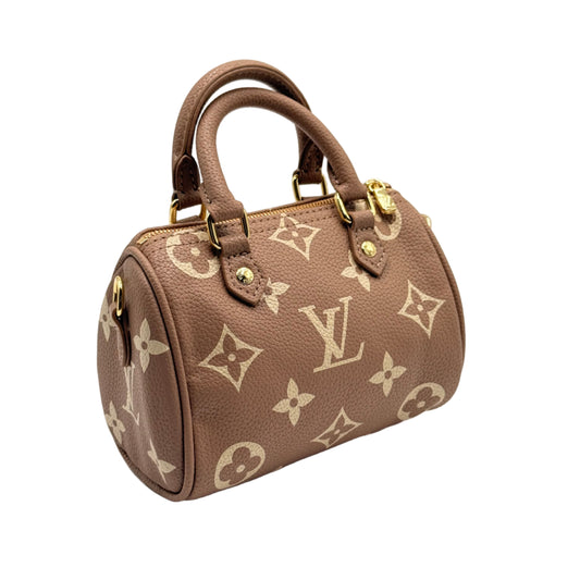 Brown handbag with gold accents on a light gray background