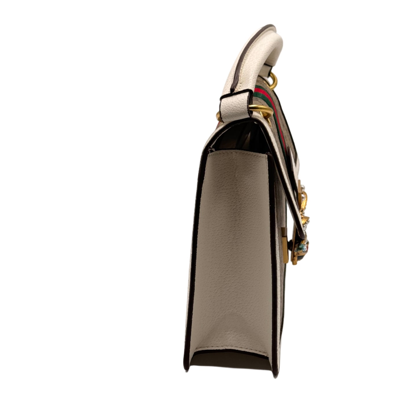 Close-up of a metallic belt buckle with a strap on a light gray background