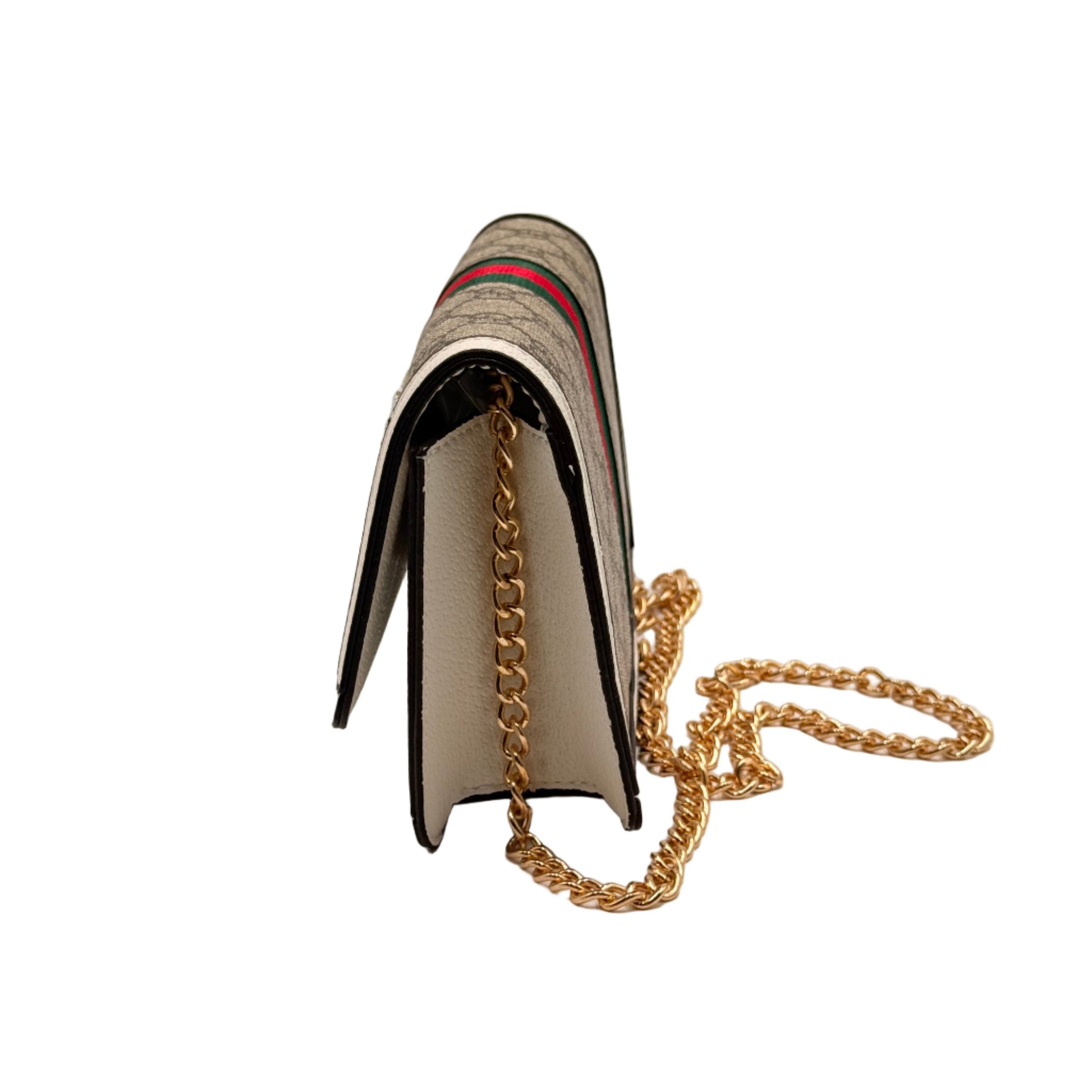 Book-shaped handbag with gold chain on a light gray background