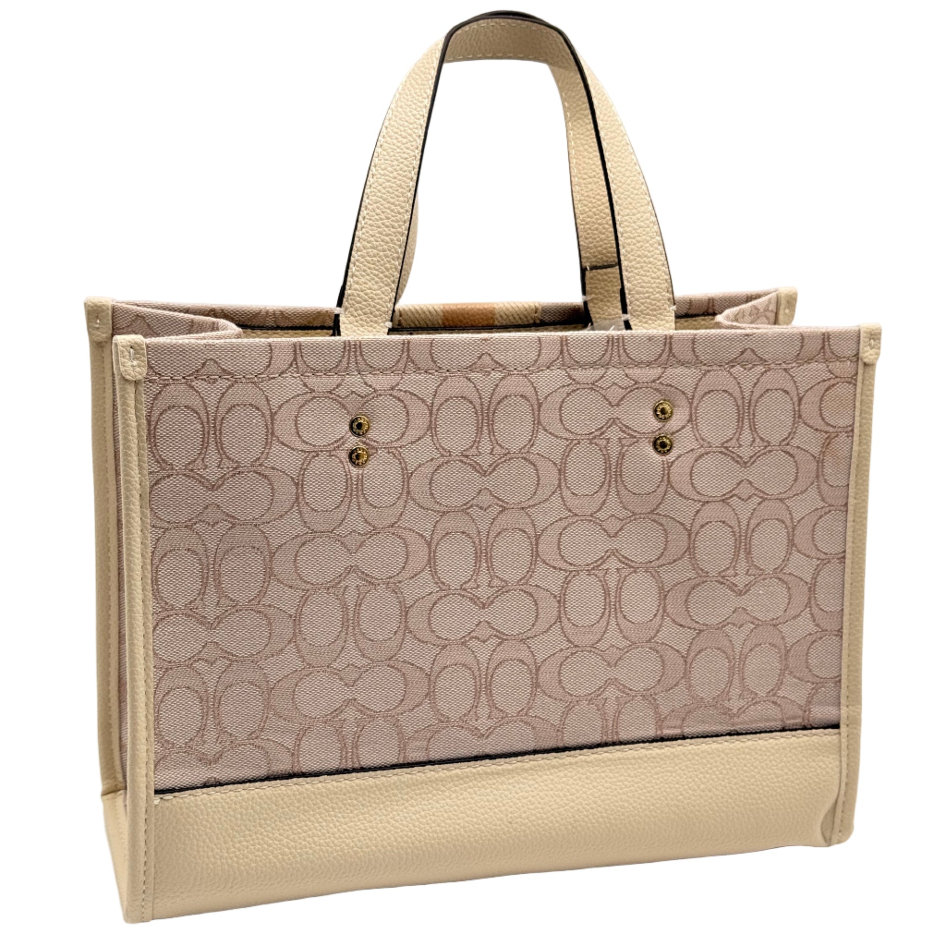 Beige handbag with a patterned design on a light background