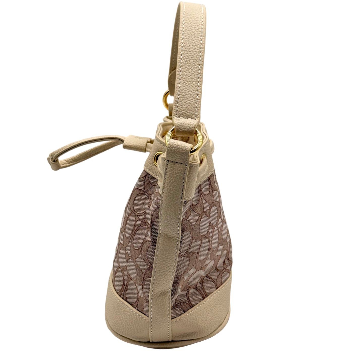 Beige handbag with patterned interior on a light gray background