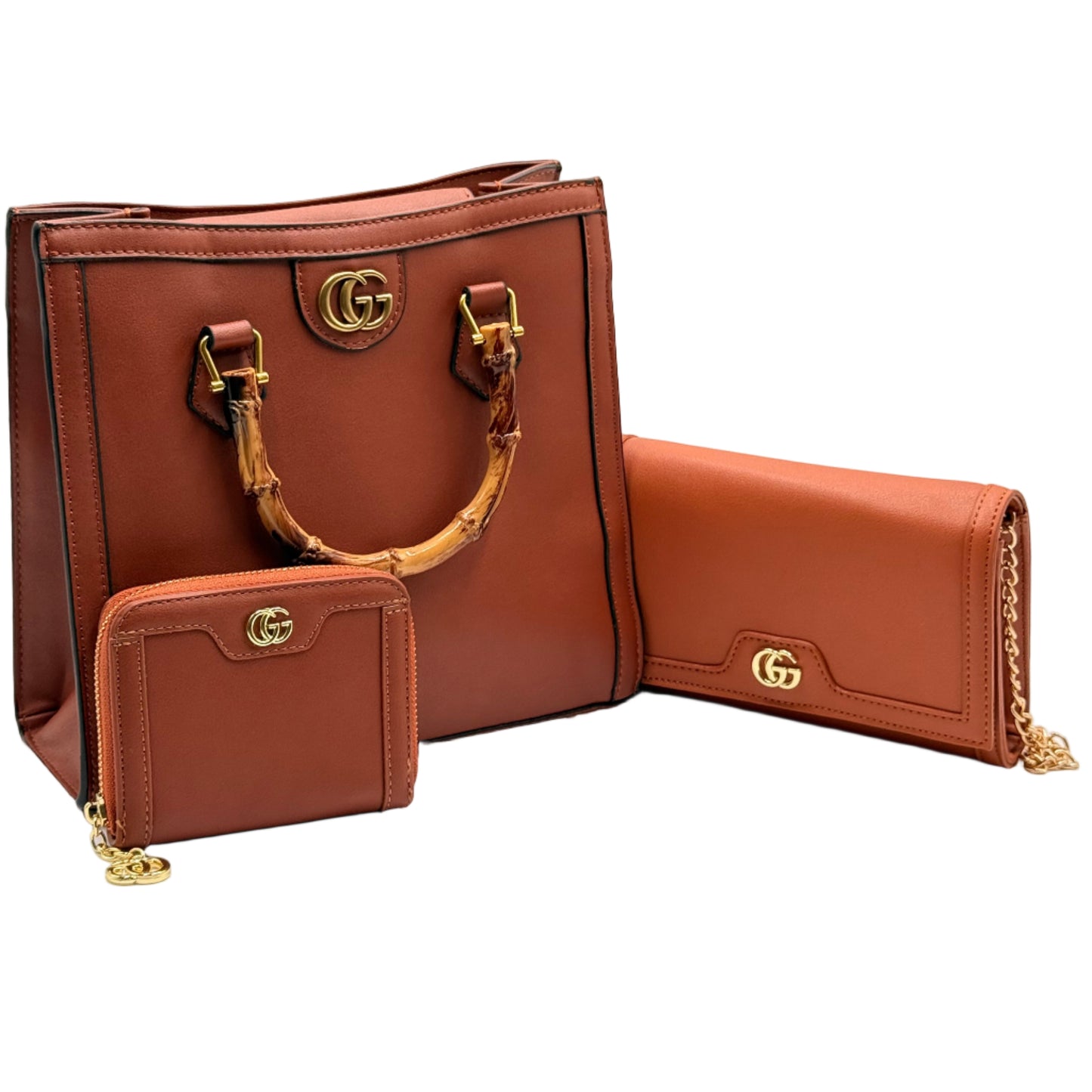 Brown leather handbag with gold hardware on a light gray background