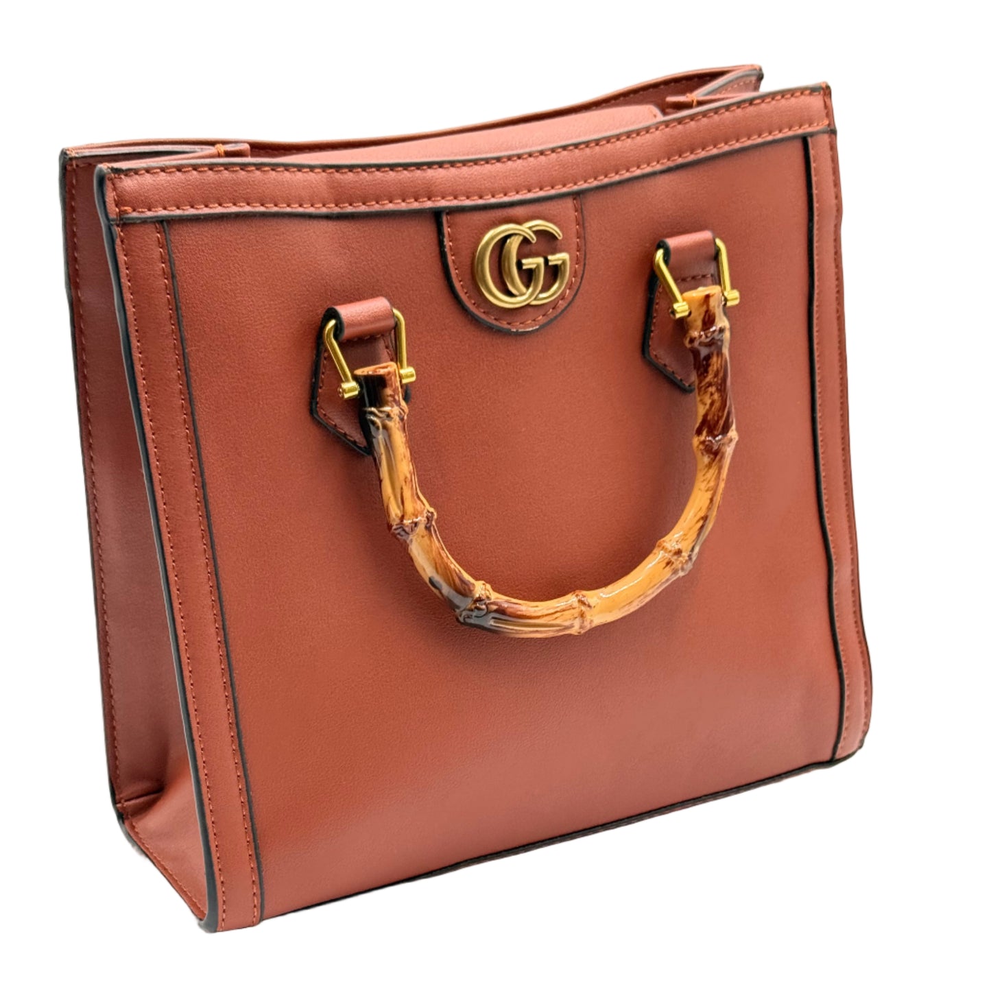 Brown leather handbag with gold hardware on a light gray background