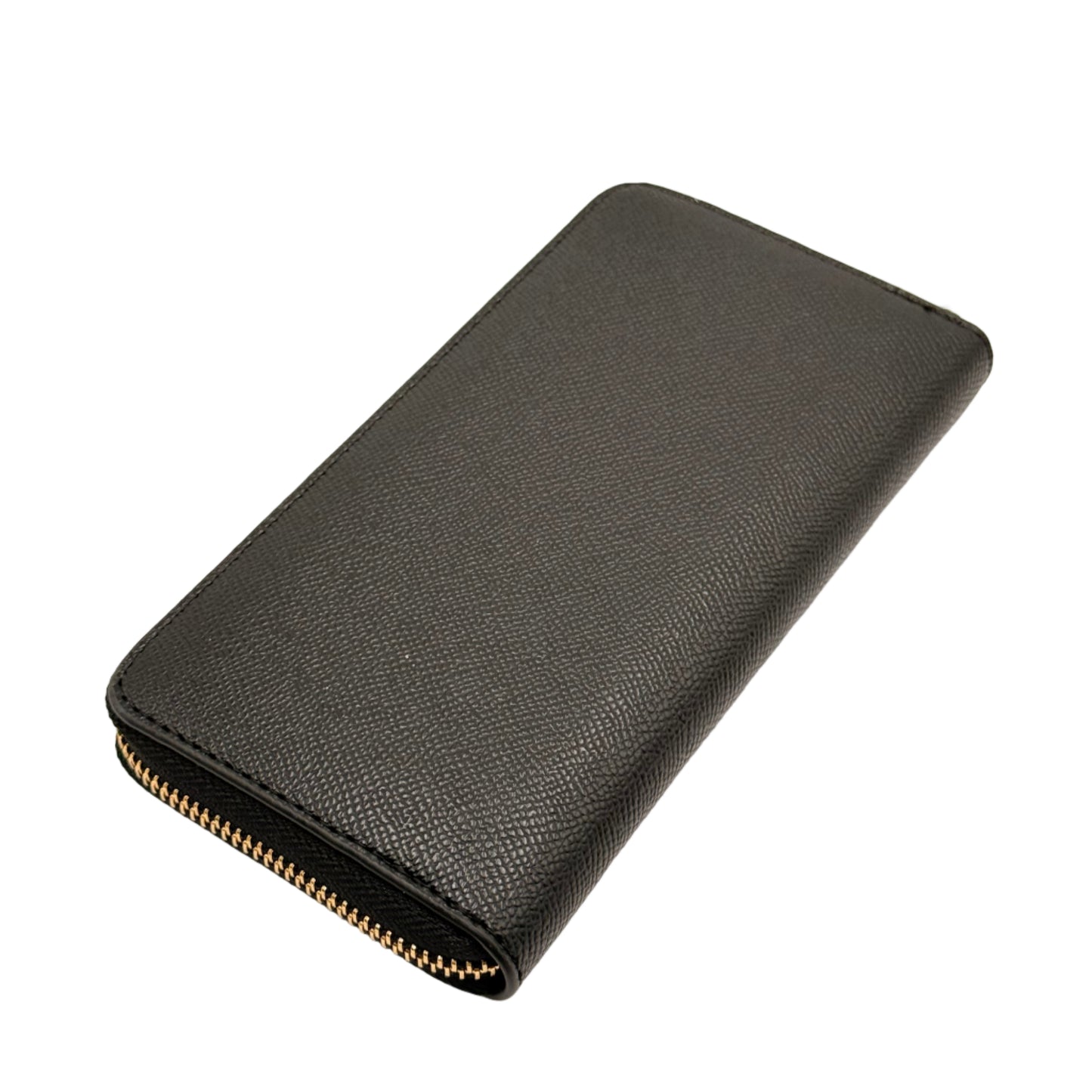 Black leather wallet with gold zipper on a beige background
