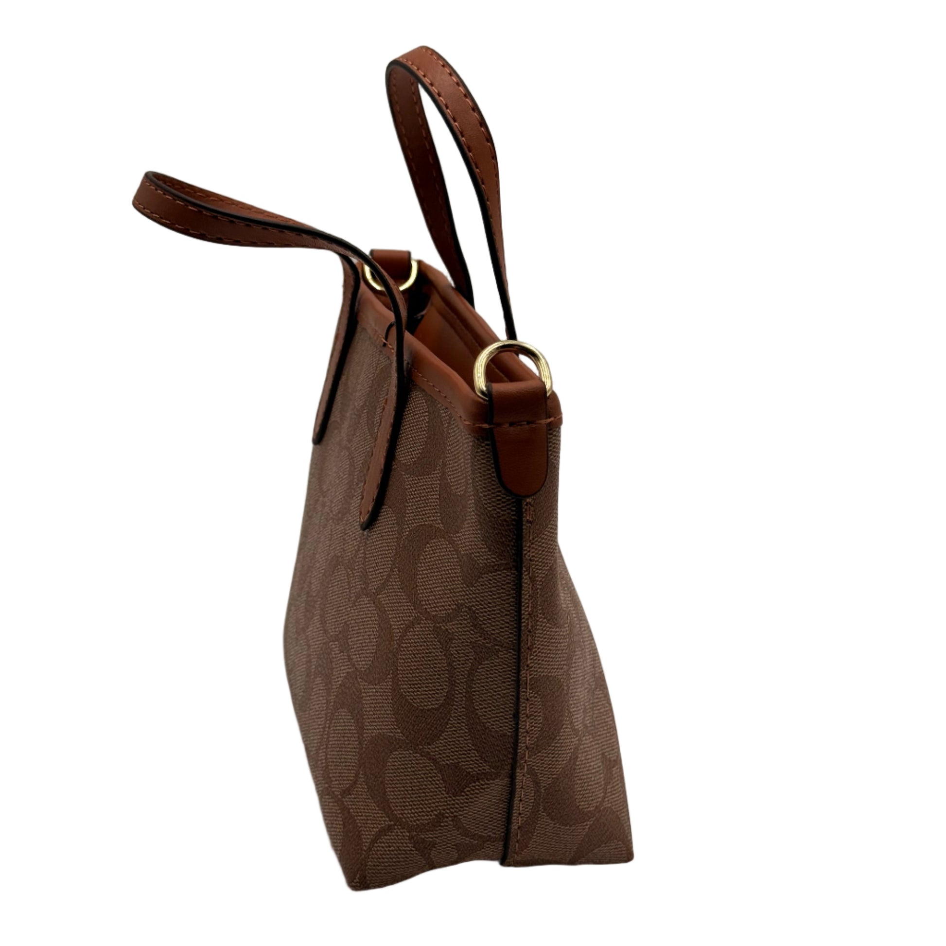 Brown handbag with leather strap on a light gray background