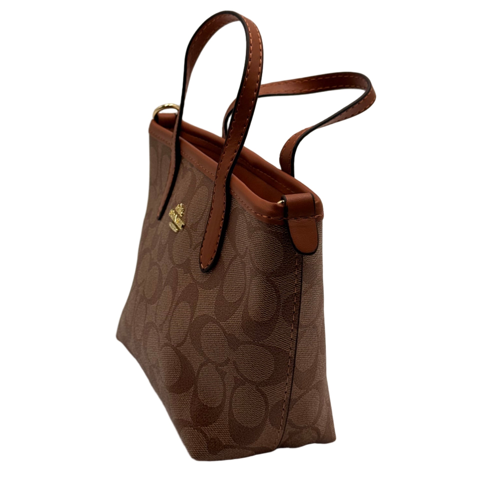 Brown handbag with floral pattern on a light gray background
