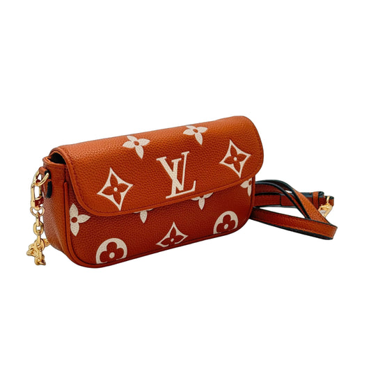 Brown handbag with white logo pattern on a light gray background