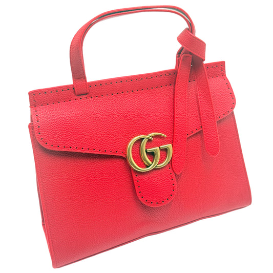 Red handbag with a gold clasp on a light gray background
