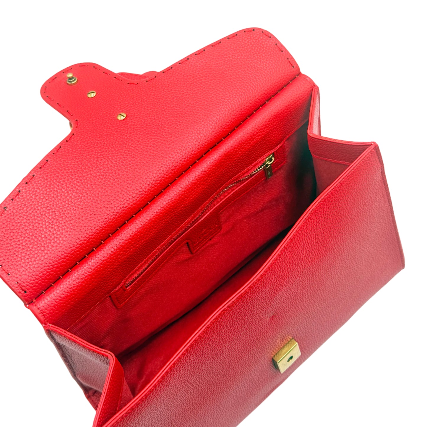 Red leather handbag with gold accents on a white background