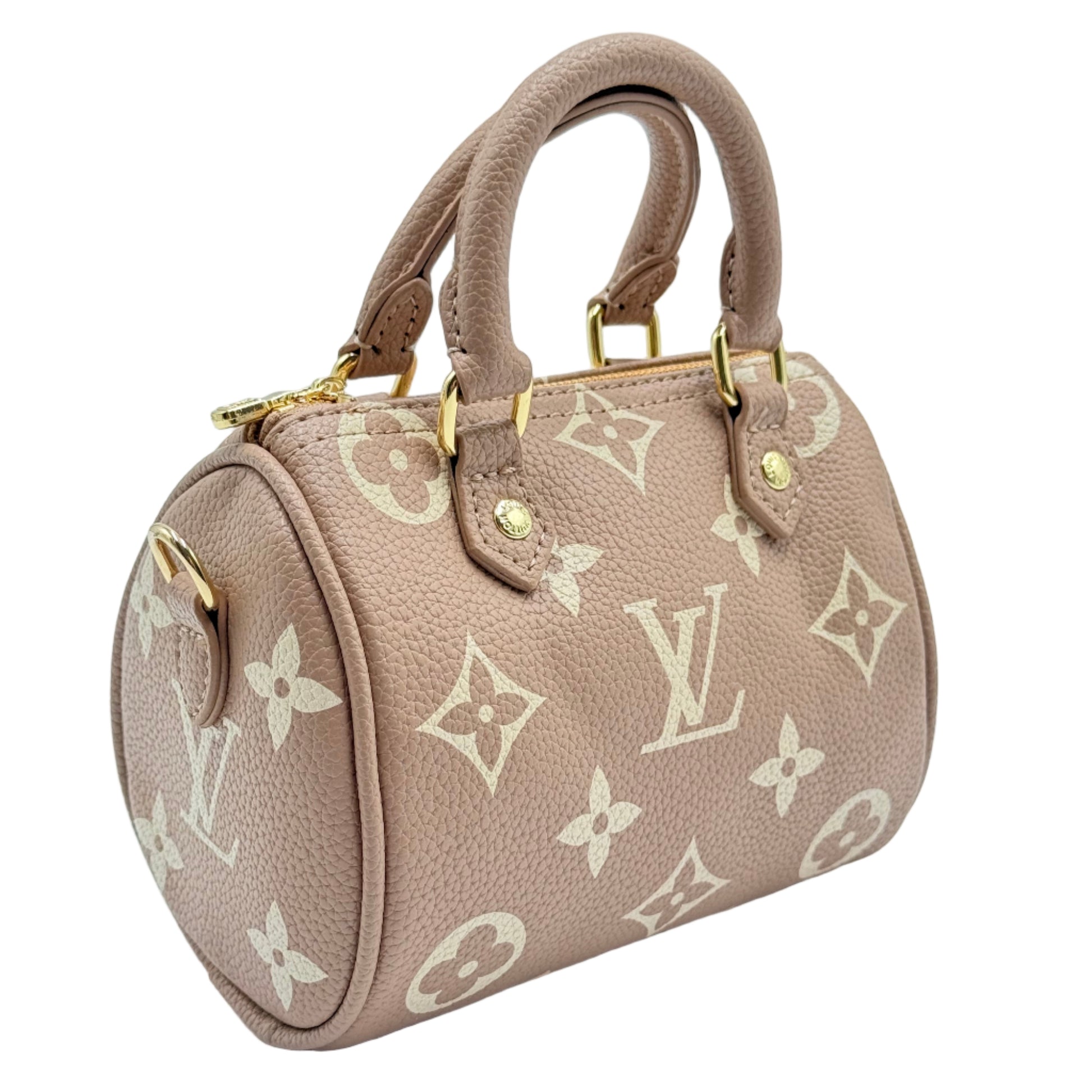 Beige handbag with monogram pattern on a light blue background