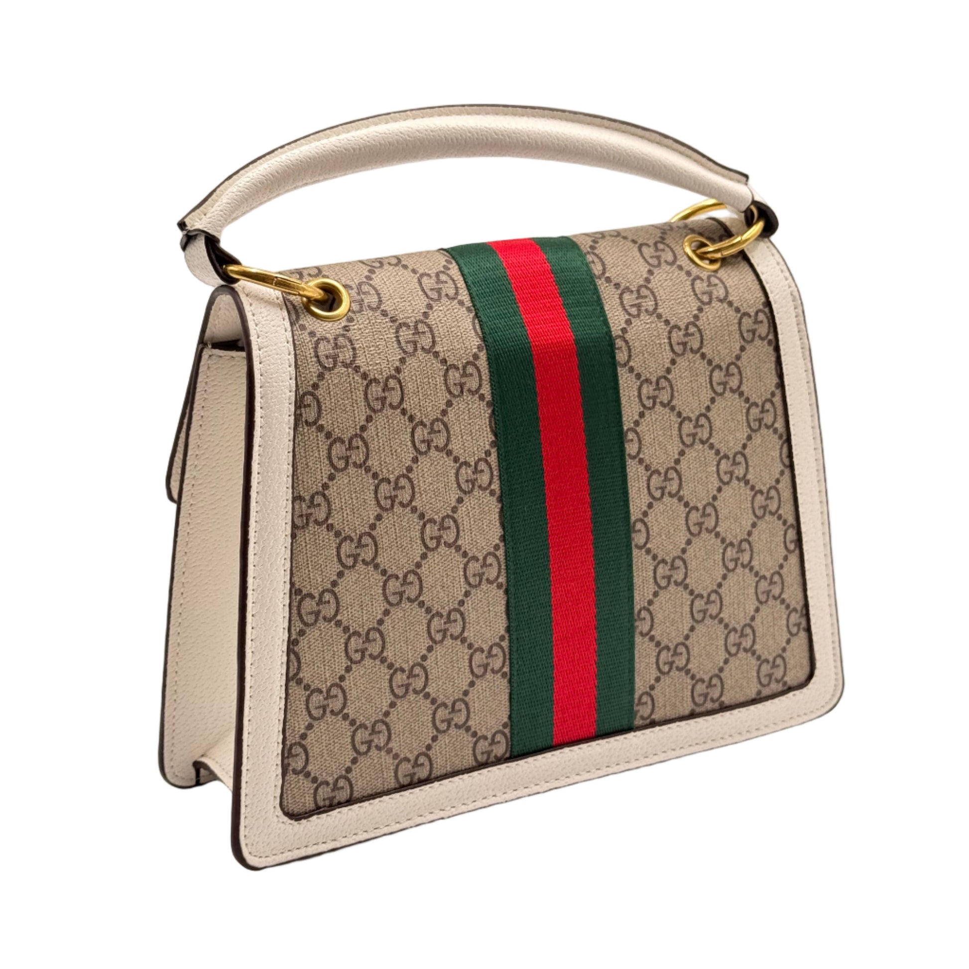 Gucci handbag with monogram pattern and red and green stripe on a light gray background