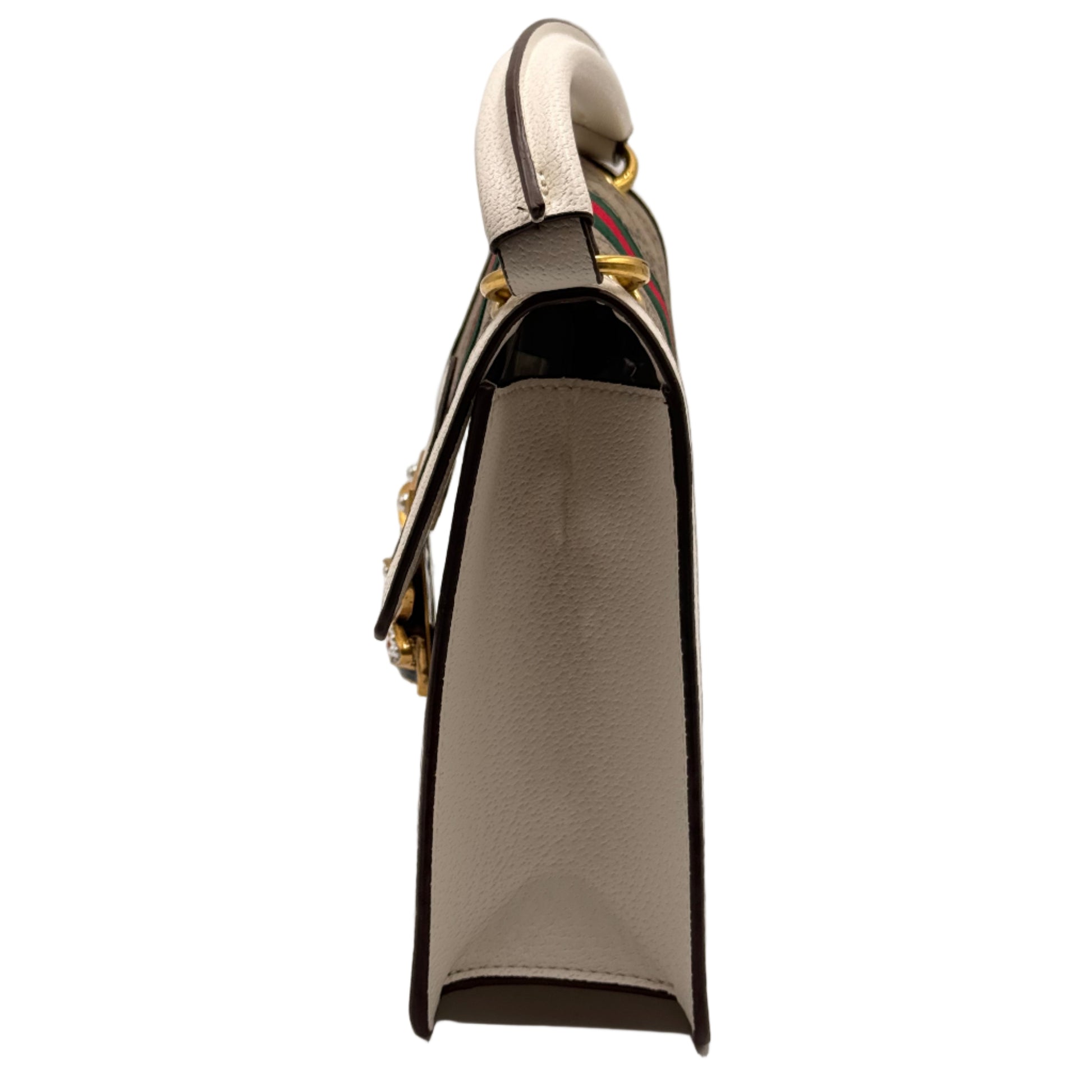 Metallic keychain with a black and gold design on a light gray background