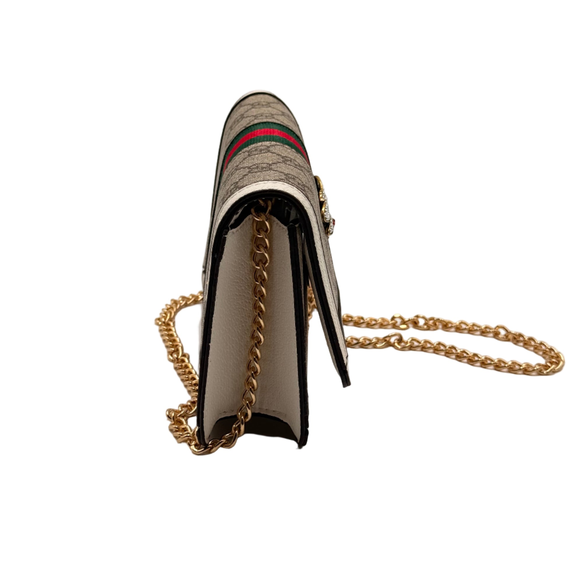 Designer handbag with chain strap on a light gray background