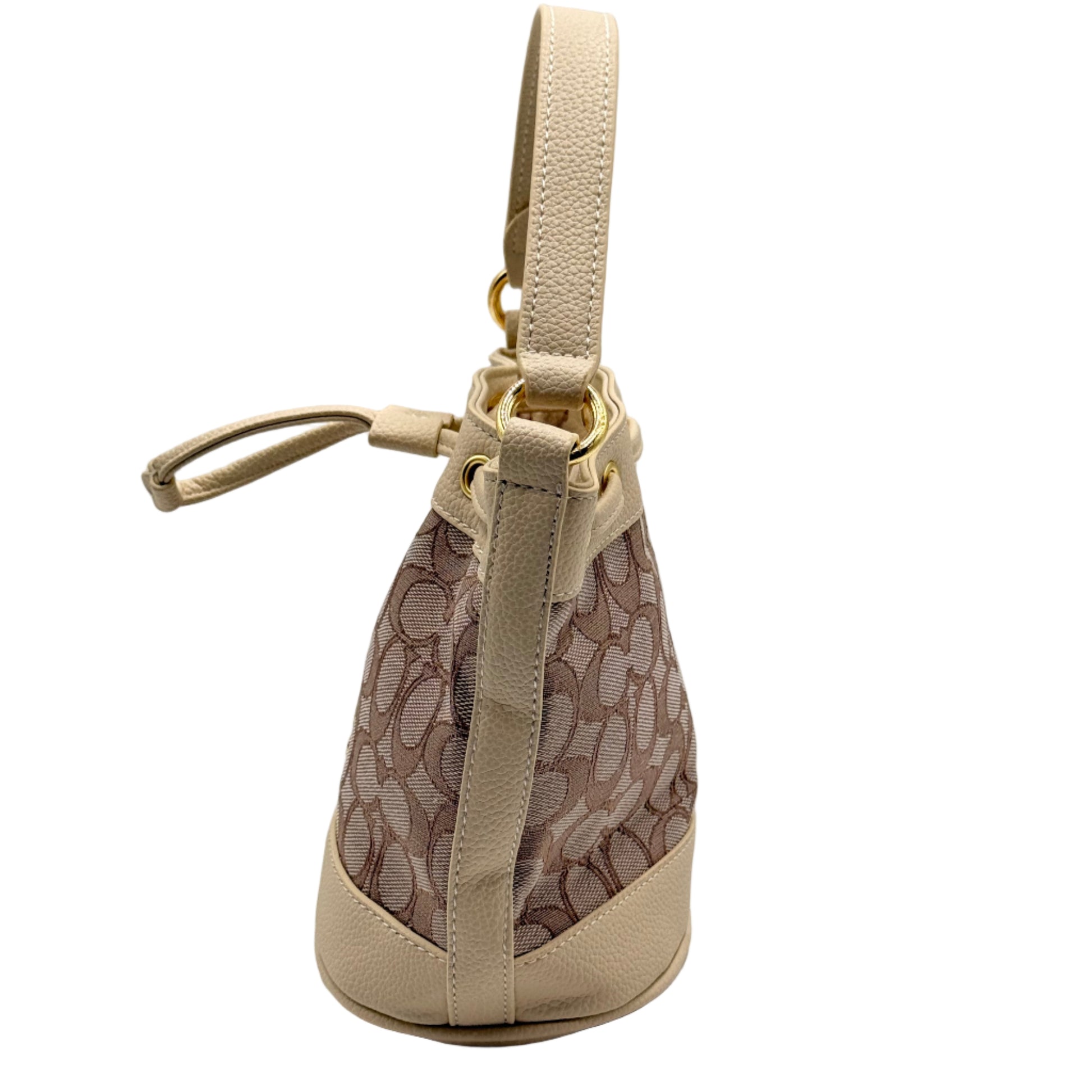 Beige handbag with patterned interior on a light gray background