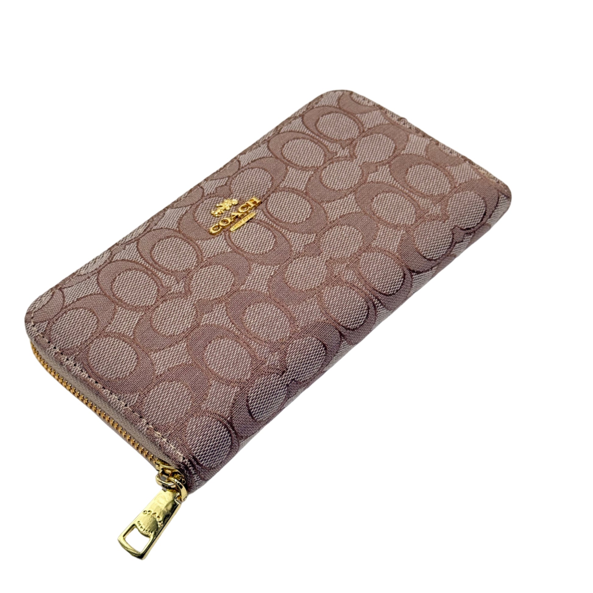 Patterned wallet with gold zipper on a light gray background