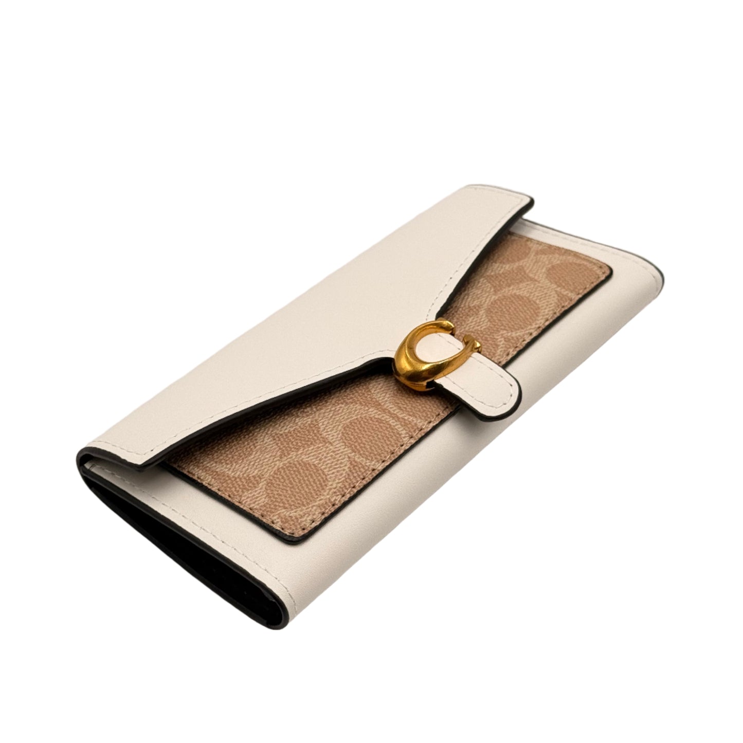 Designer handbag with gold clasp on a light gray background