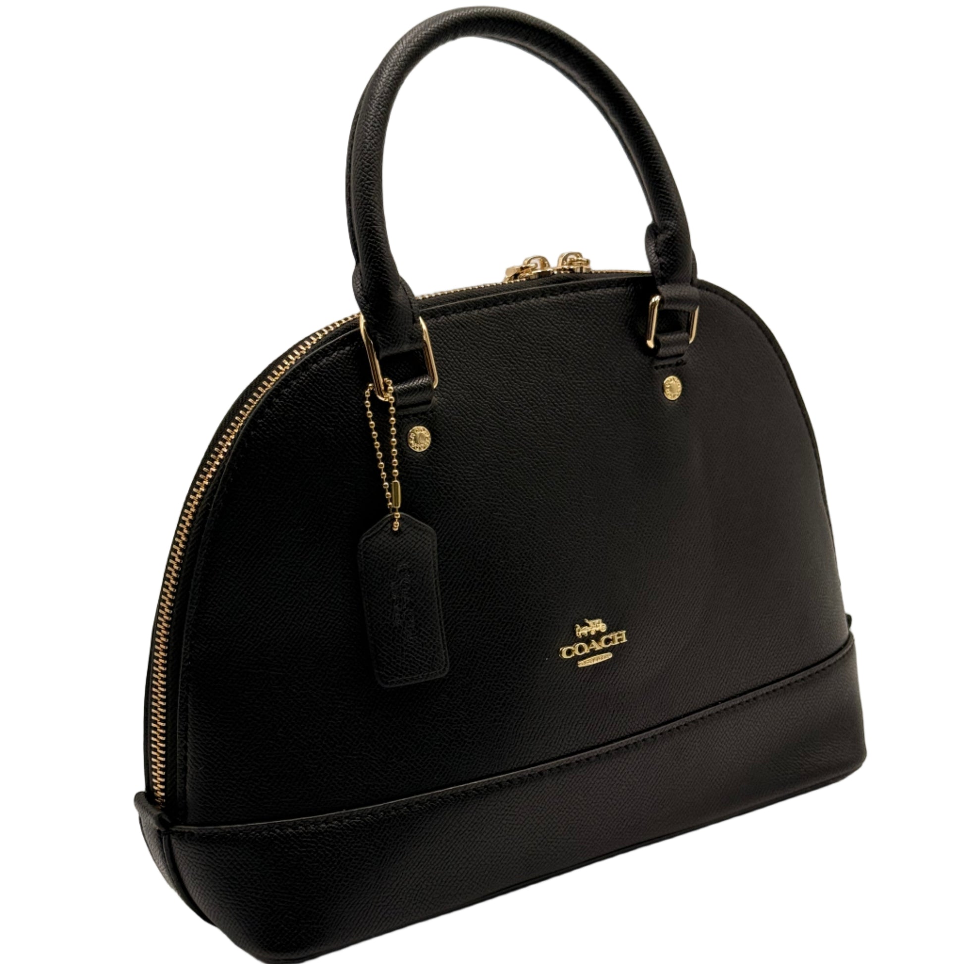 Black handbag with gold accents on a light gray background