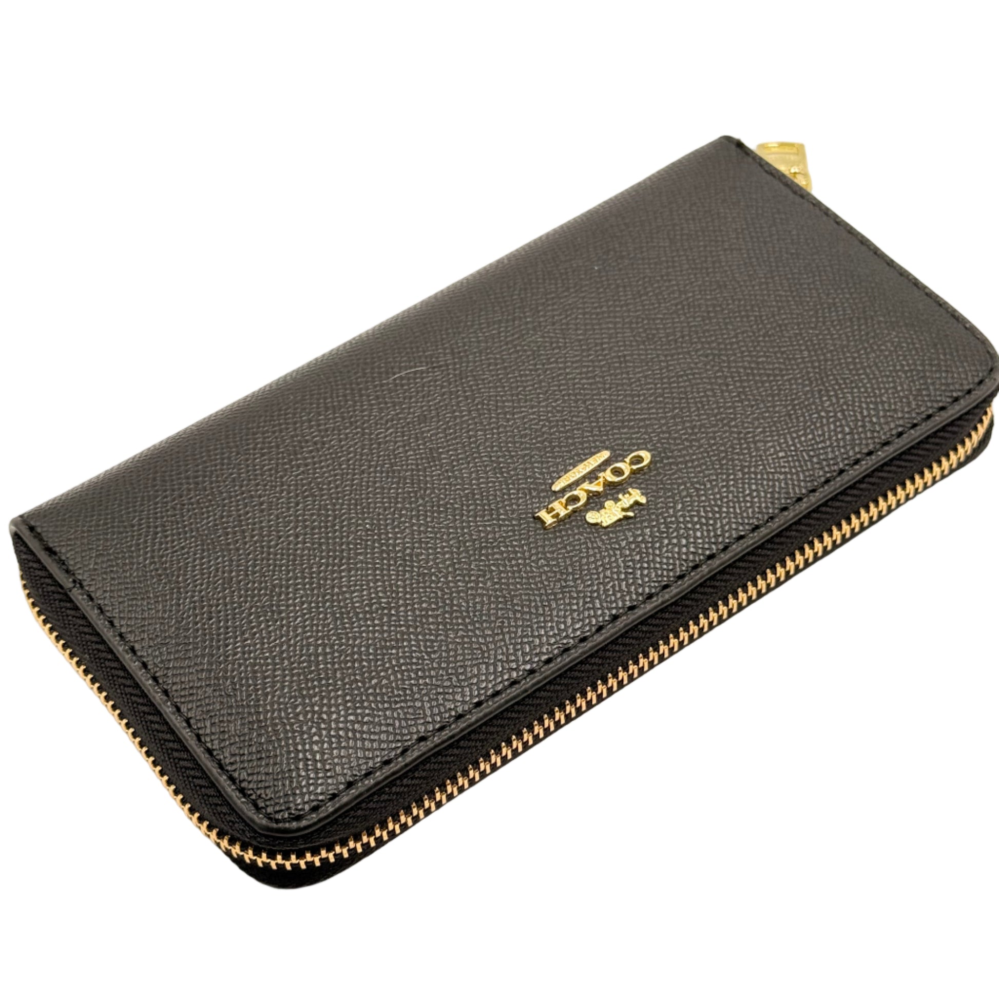 Black wallet with gold zipper and logo on a beige background