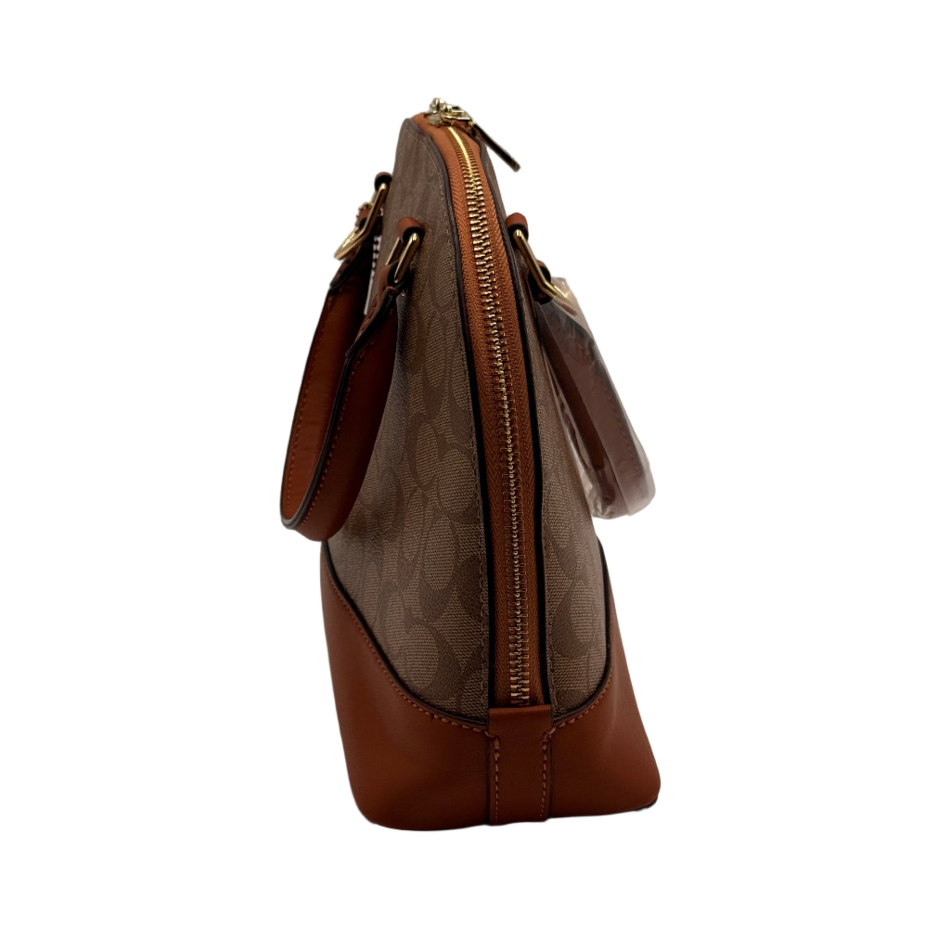 Brown leather handbag with gold zipper on a light gray background