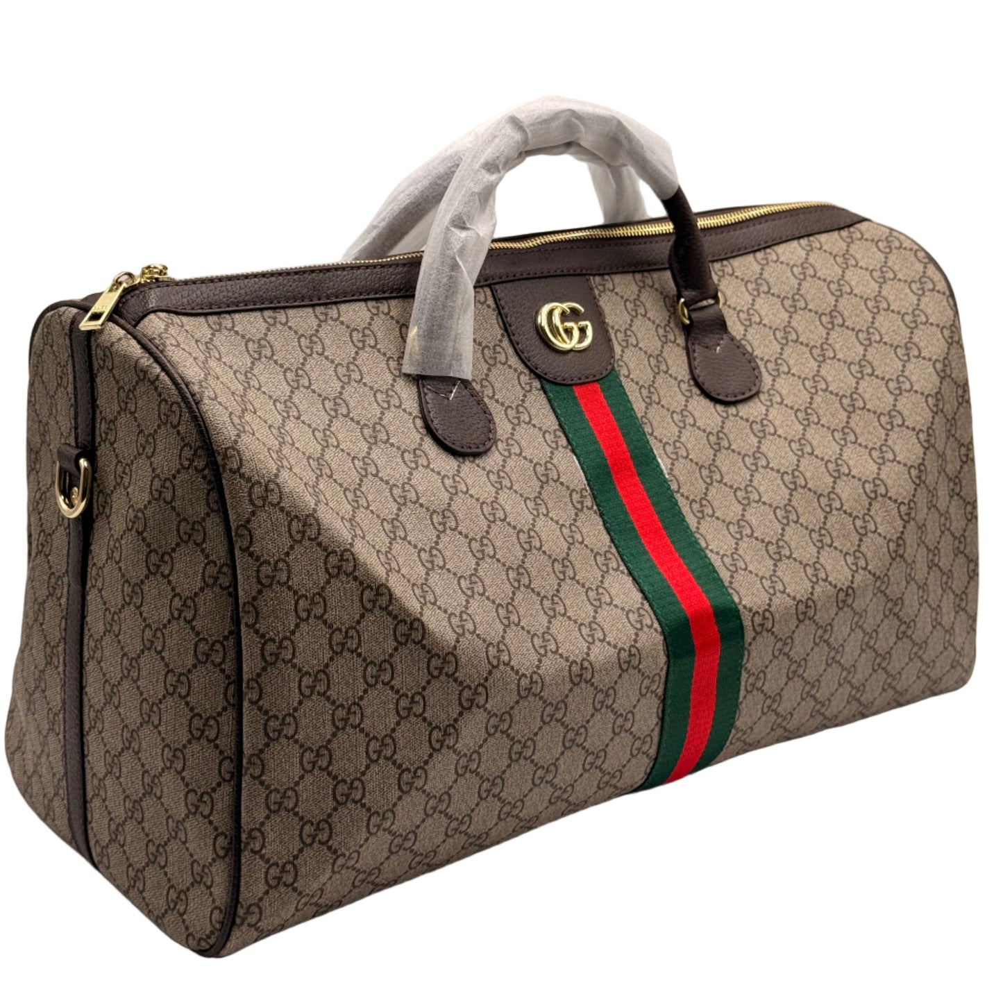 Gucci duffel bag with monogram pattern and red and green stripe on a light gray background